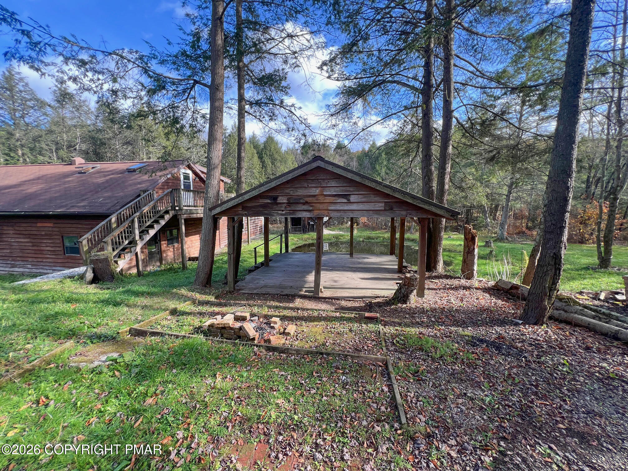 2564 Hills Creek Lake Road Wellsboro, PA 16901 - Photo 17 of 26 a view of a house with a yard