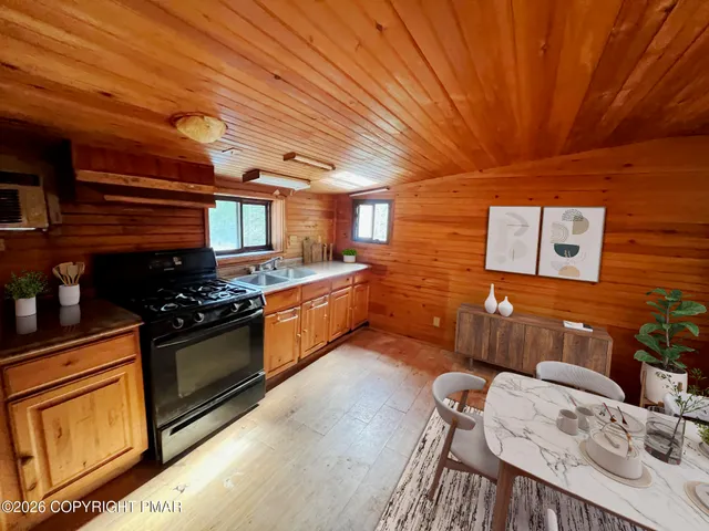 a living room with furniture and flat screen tv