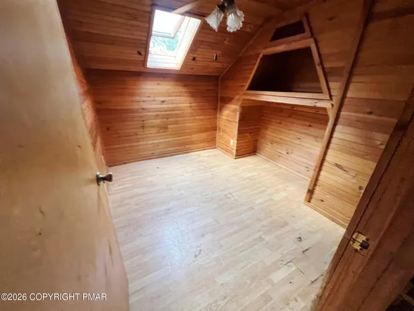 a bathroom with a shower and a sink