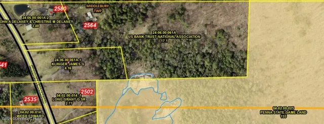 a view of an empty room with a fireplace