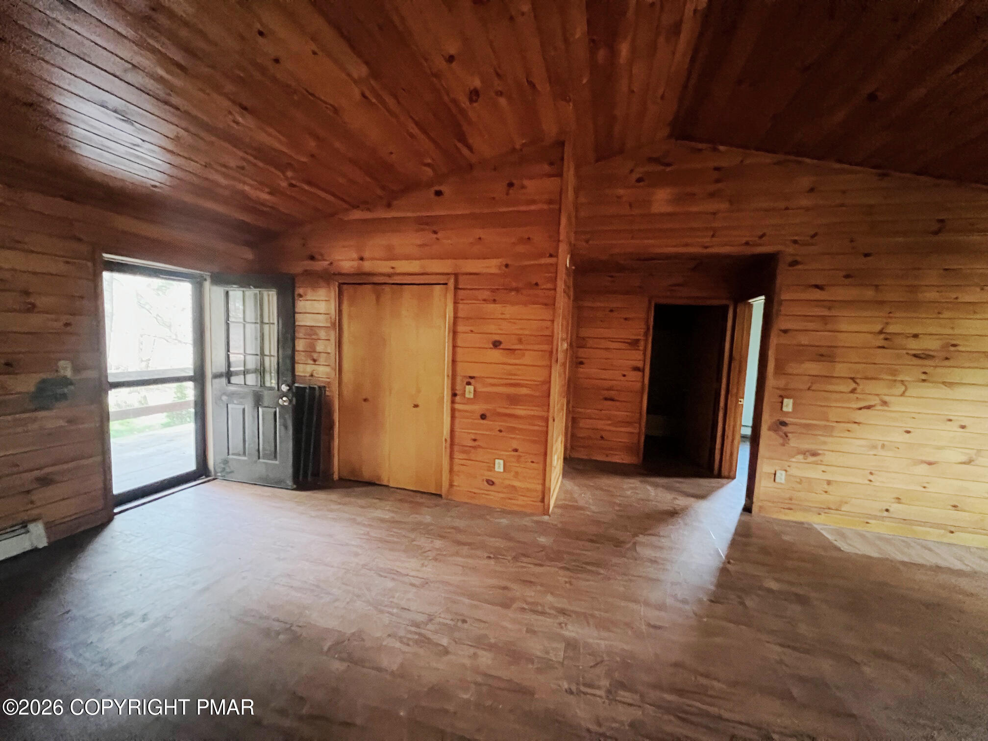 2564 Hills Creek Lake Road Wellsboro, PA 16901 - Photo 4 of 26 a view of an empty room with a fireplace