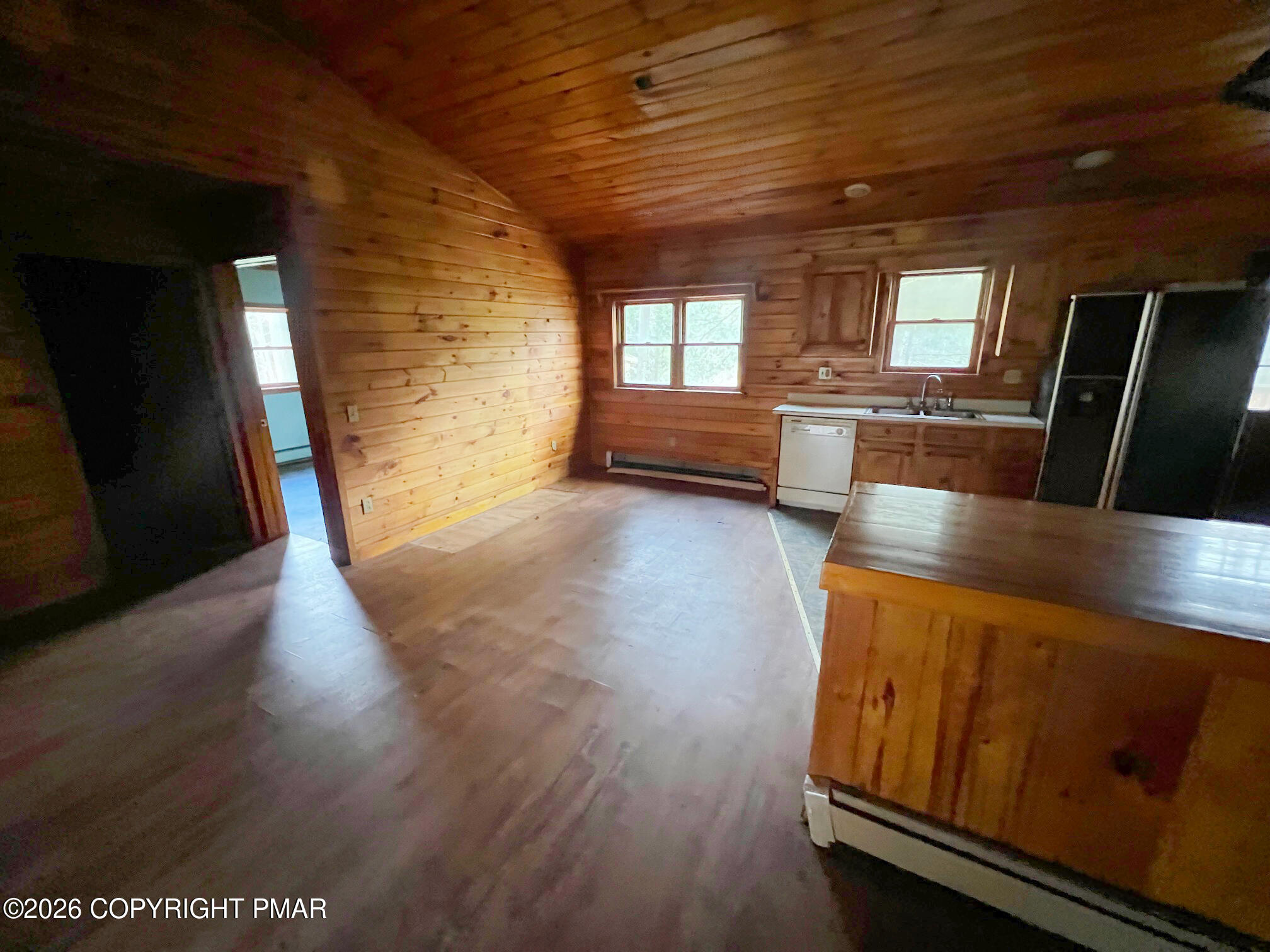 2564 Hills Creek Lake Road Wellsboro, PA 16901 - Photo 6 of 26 a view of an empty room with wooden floor and a window