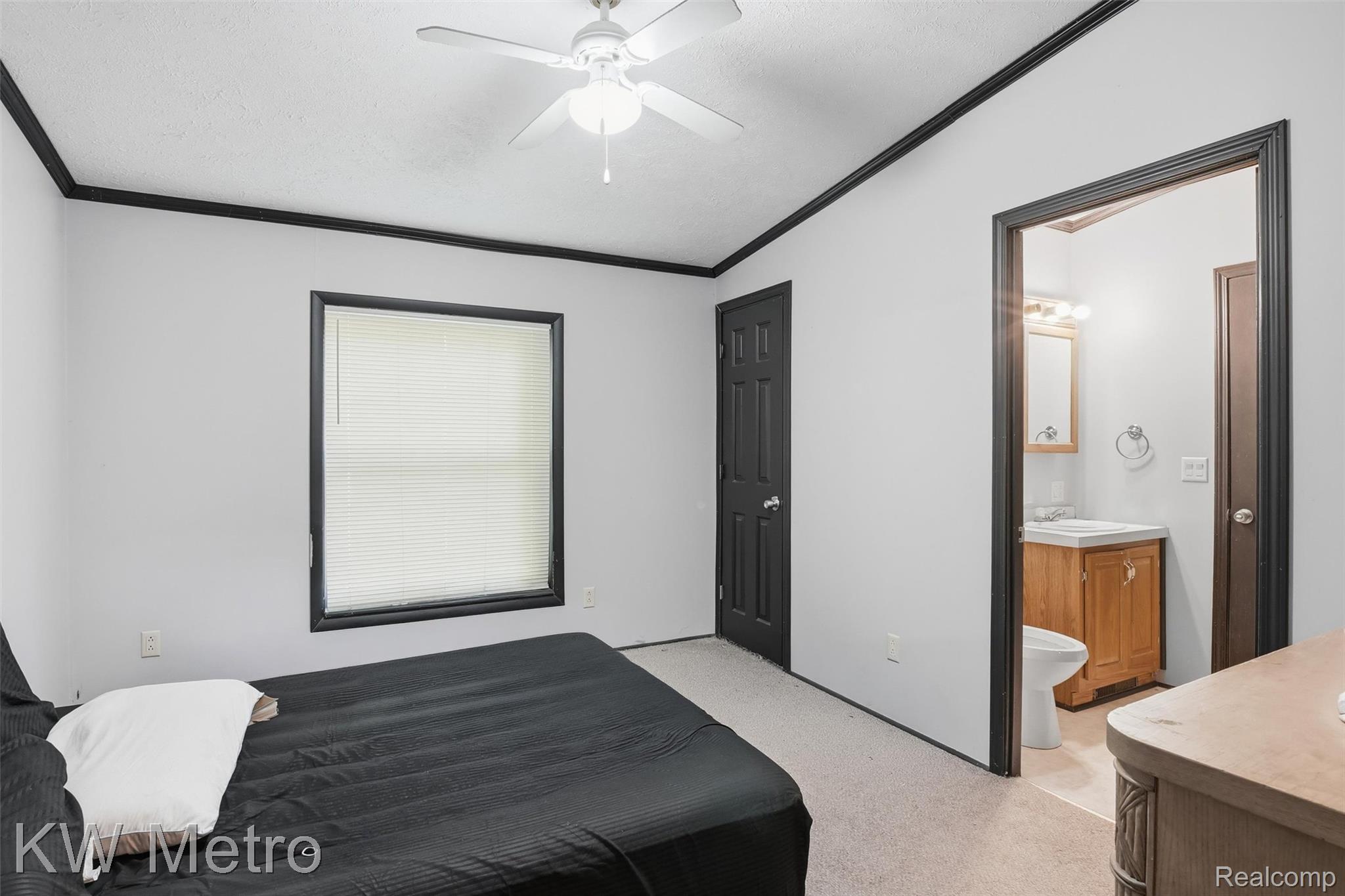 22733 Sumpter Road Belleville, MI 48111 - Photo 15 of 52 Bedroom featuring an overhead ceiling fan, window with blinds, and contrasting dark trim