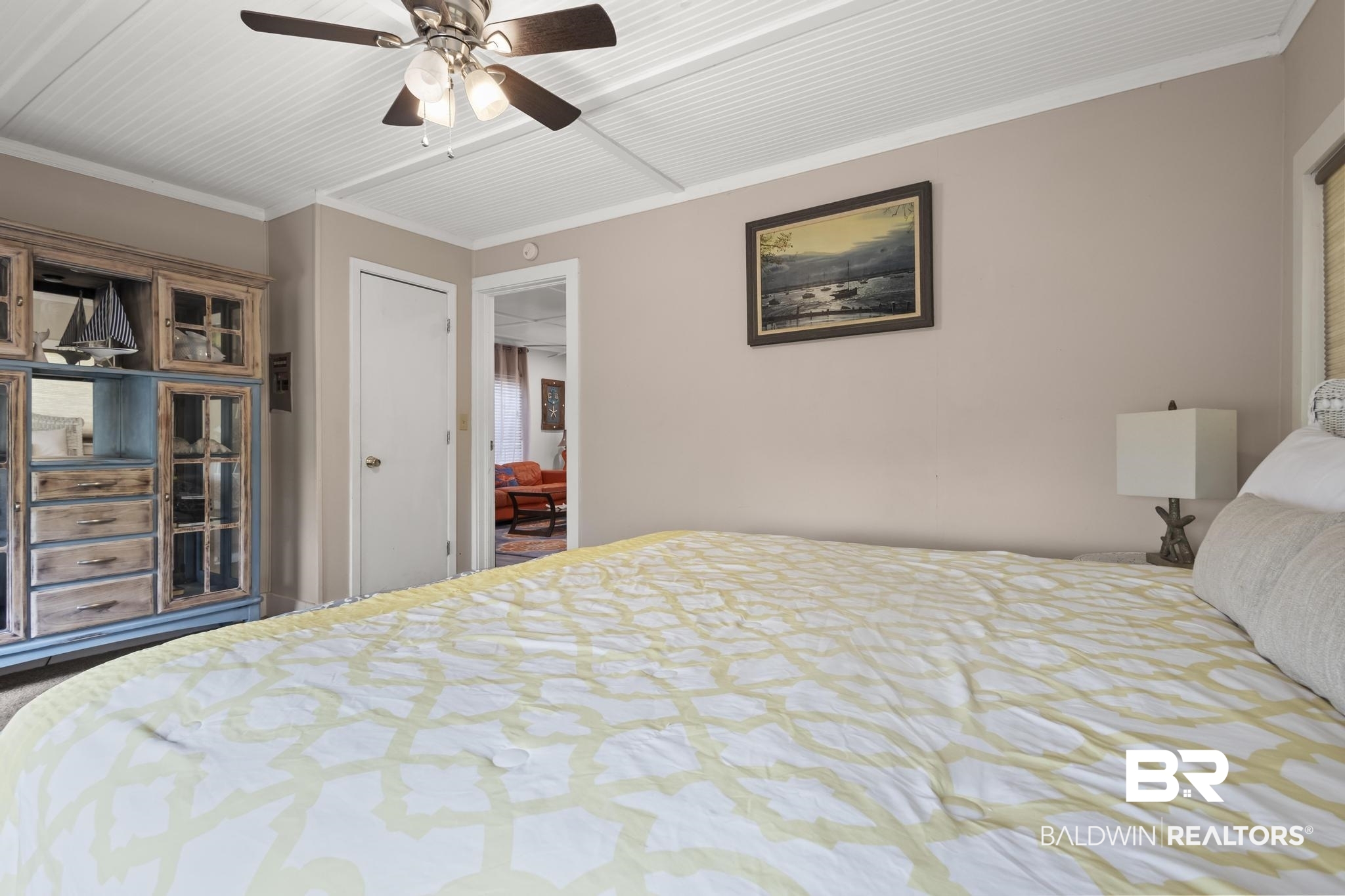 562 Veterans Road Gulf Shores, AL 36542 - Photo 17 of 32 Bedroom with ceiling fan, carpet floors, and crown molding