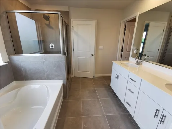 a bathroom with a sink a mirror and vanity