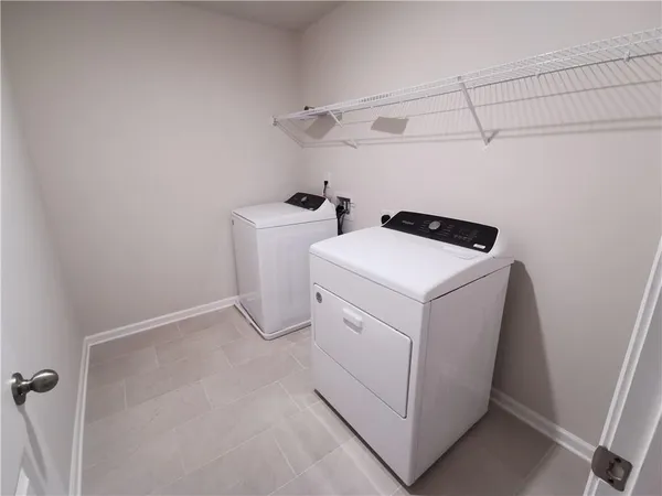 an empty room with a empty space and windows