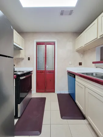 a kitchen with stainless steel appliances granite countertop a stove and a sink