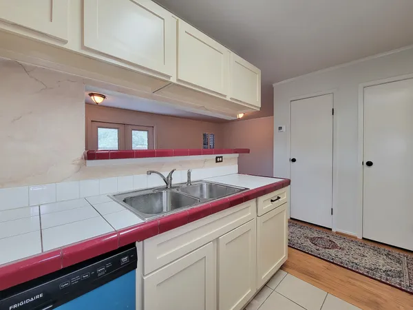 a kitchen with a sink and cabinets