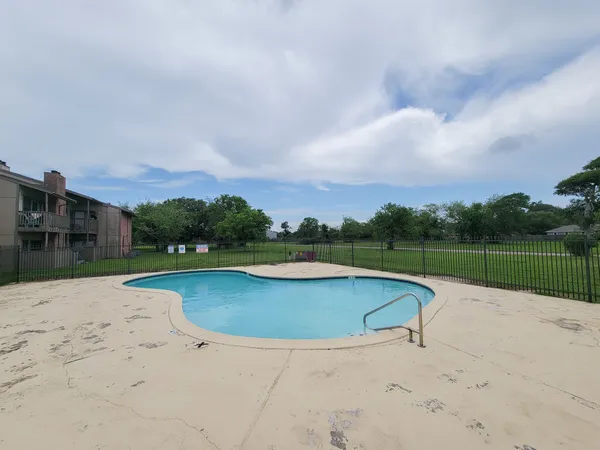 a view of swimming pool with a yard