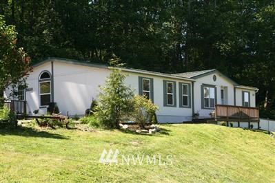 5620 Osprey Road Freeland, WA 98249 - Photo 1 of 1 a front view of house with yard and green space