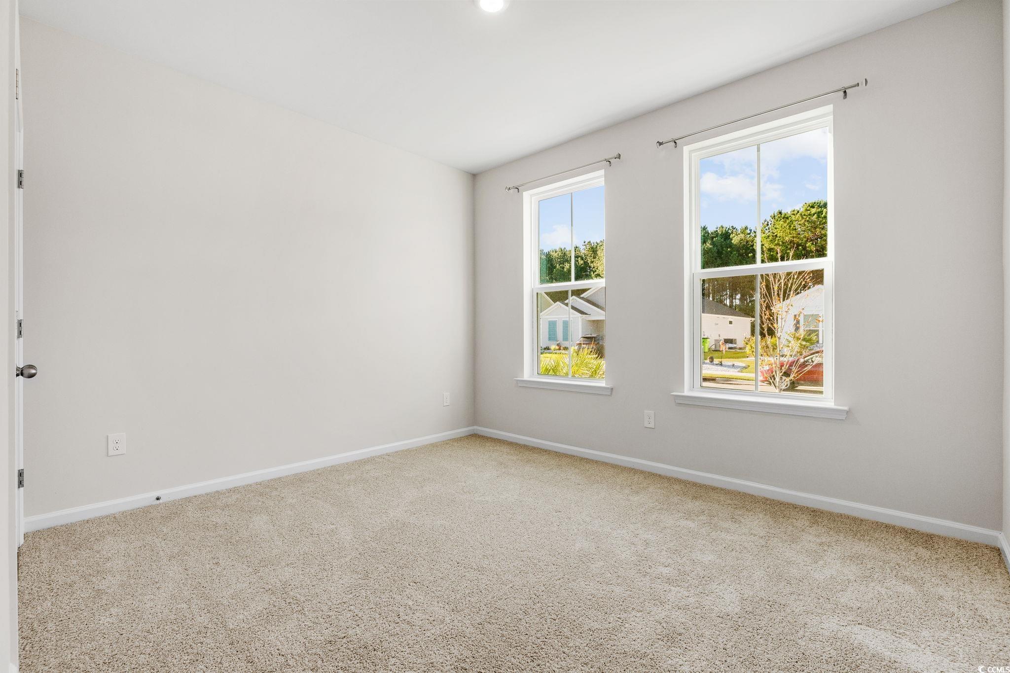 453 Kapalua Loop Little River, SC 29566 - Photo 18 of 27 Spare room with baseboards and light carpet