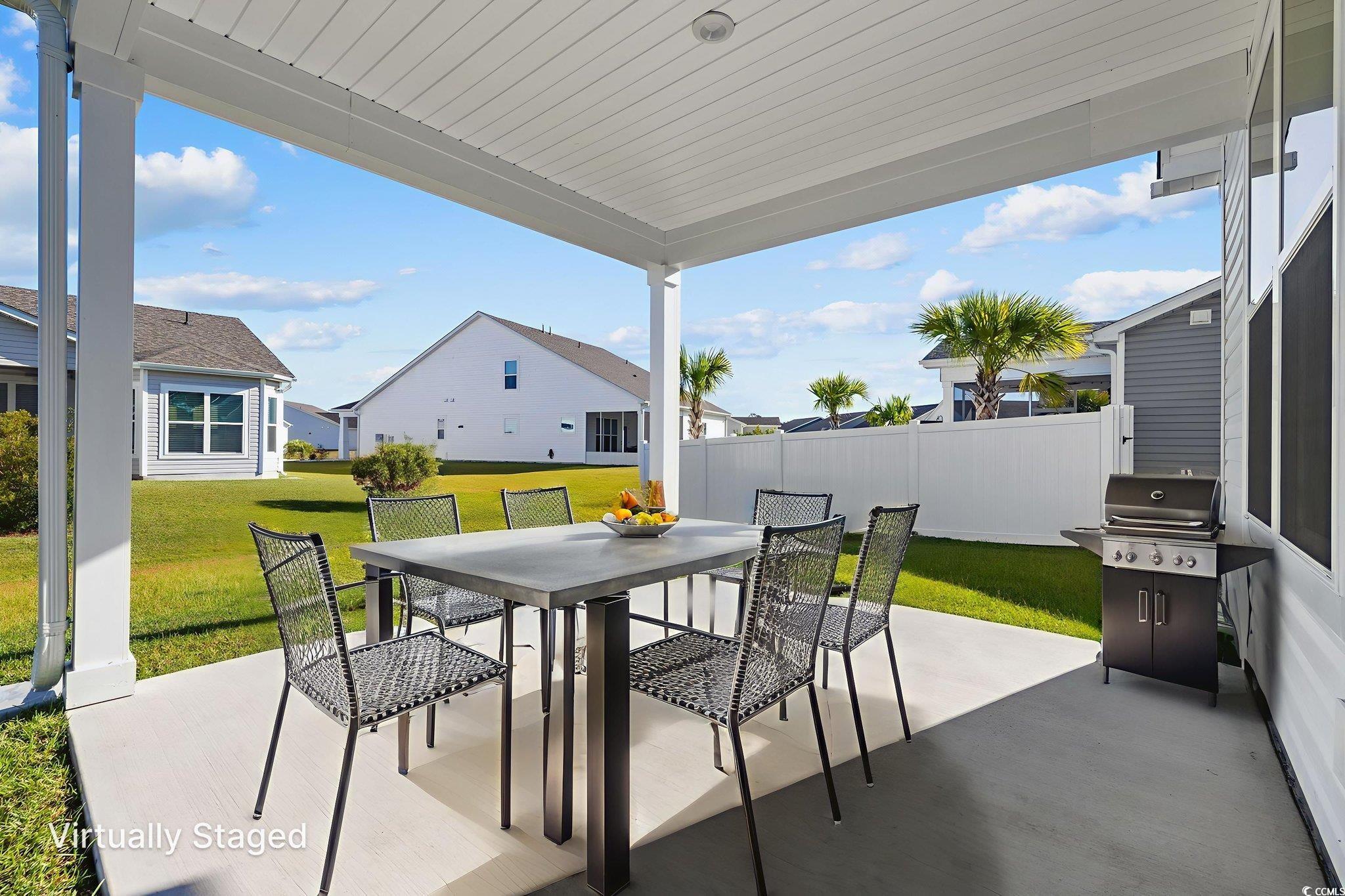 453 Kapalua Loop Little River, SC 29566 - Photo 21 of 27 View of patio with outdoor dining space and a grill