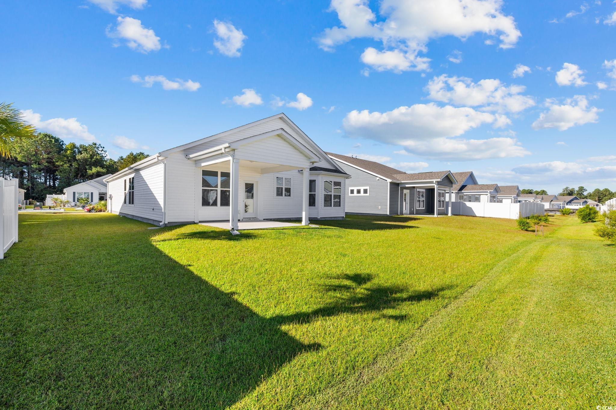 453 Kapalua Loop Little River, SC 29566 - Photo 22 of 27 Back of property with a patio area