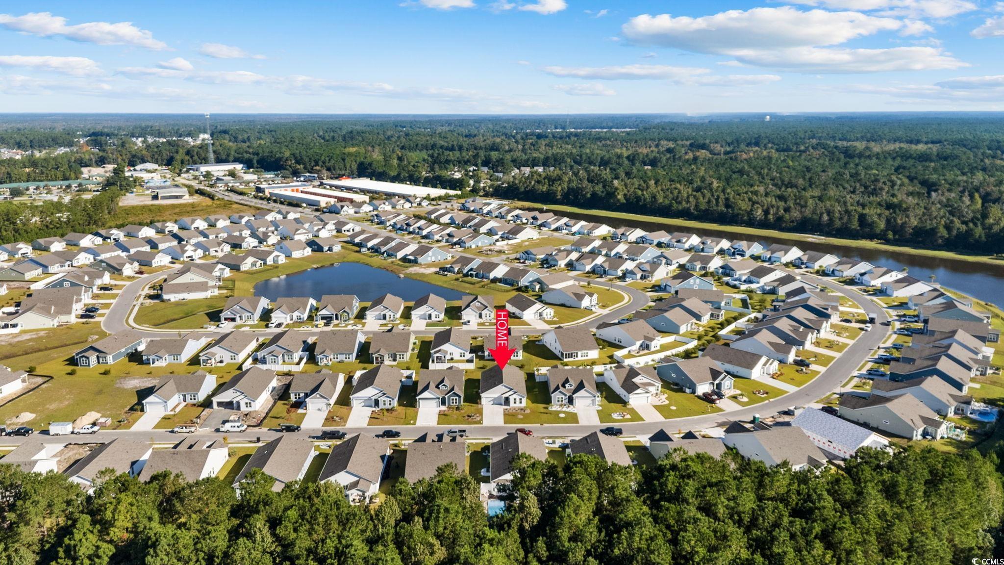 453 Kapalua Loop Little River, SC 29566 - Photo 24 of 27 Aerial view of property's location with nearby suburban area and a nearby body of water