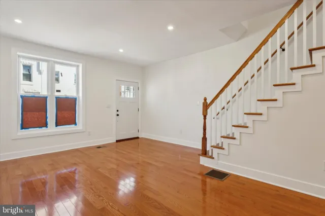 a view of an entryway with wooden floor