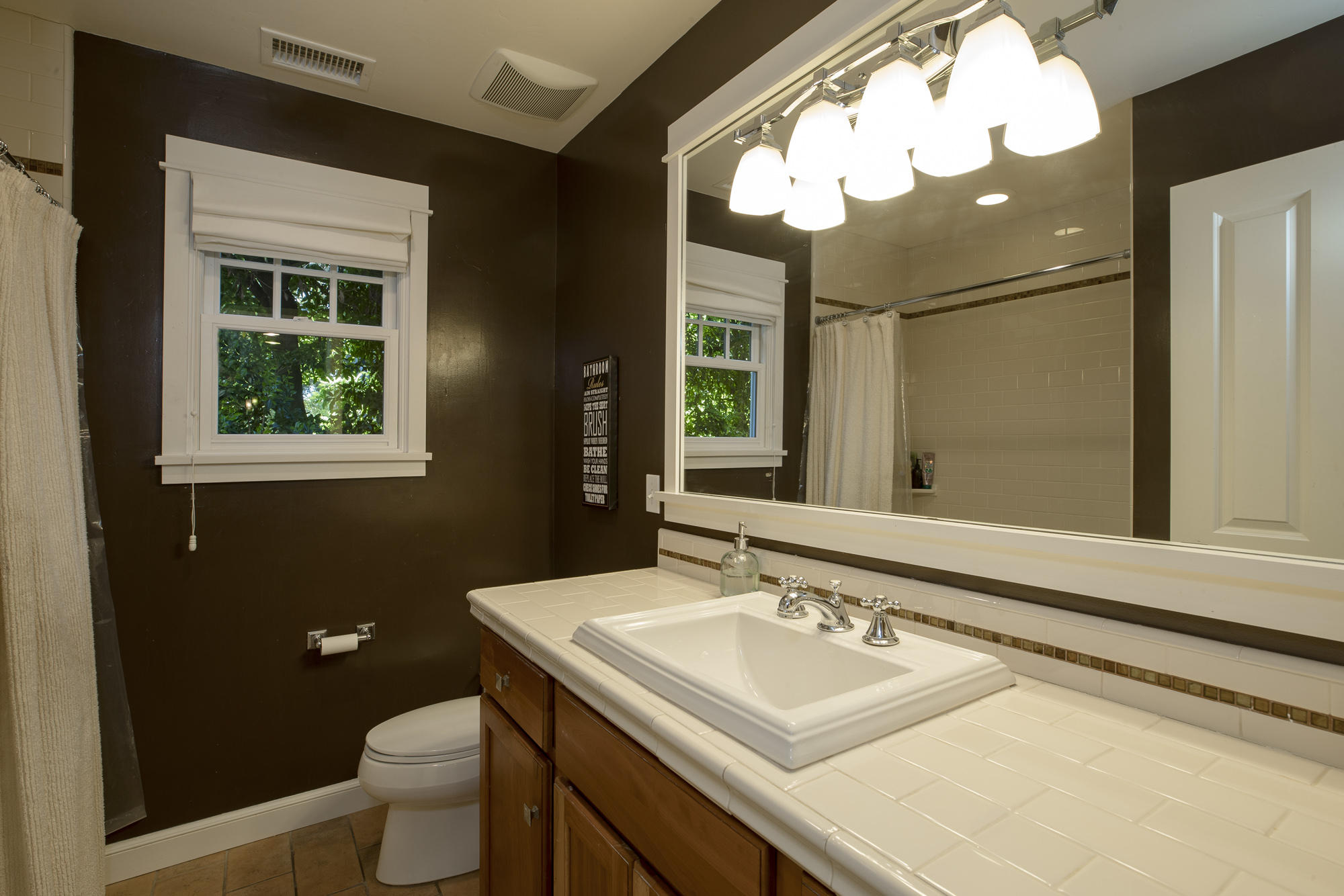 1006 Mission Ridge Road Santa Barbara, CA 93103 - Photo 11 of 21 a bathroom with a sink a toilet and a mirror