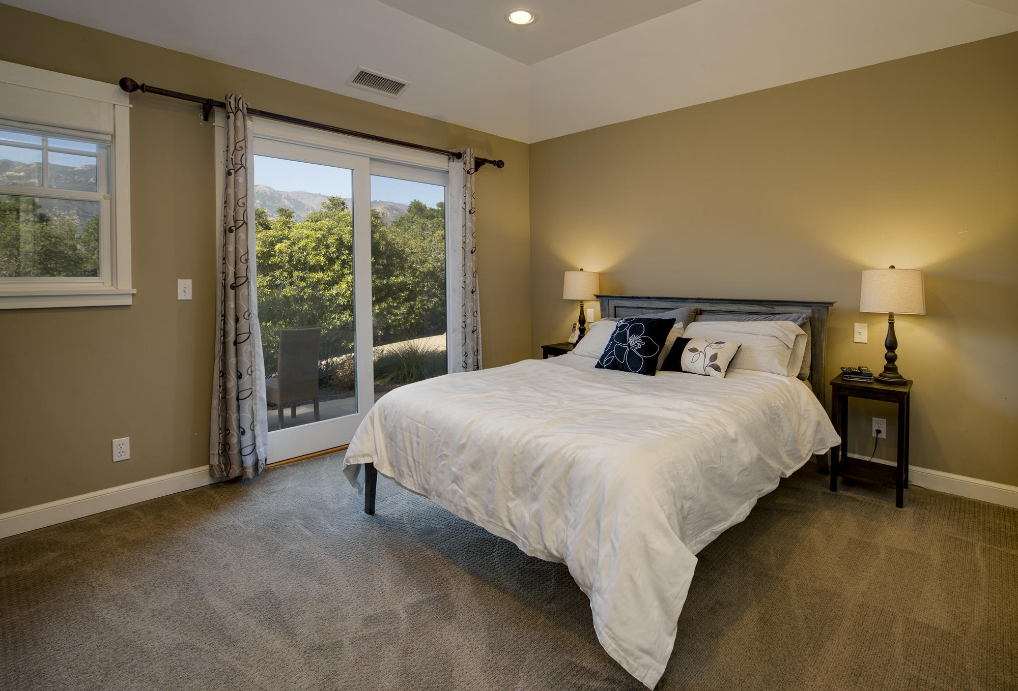 1006 Mission Ridge Road Santa Barbara, CA 93103 - Photo 6 of 21 a bed sitting in a bedroom next to a window