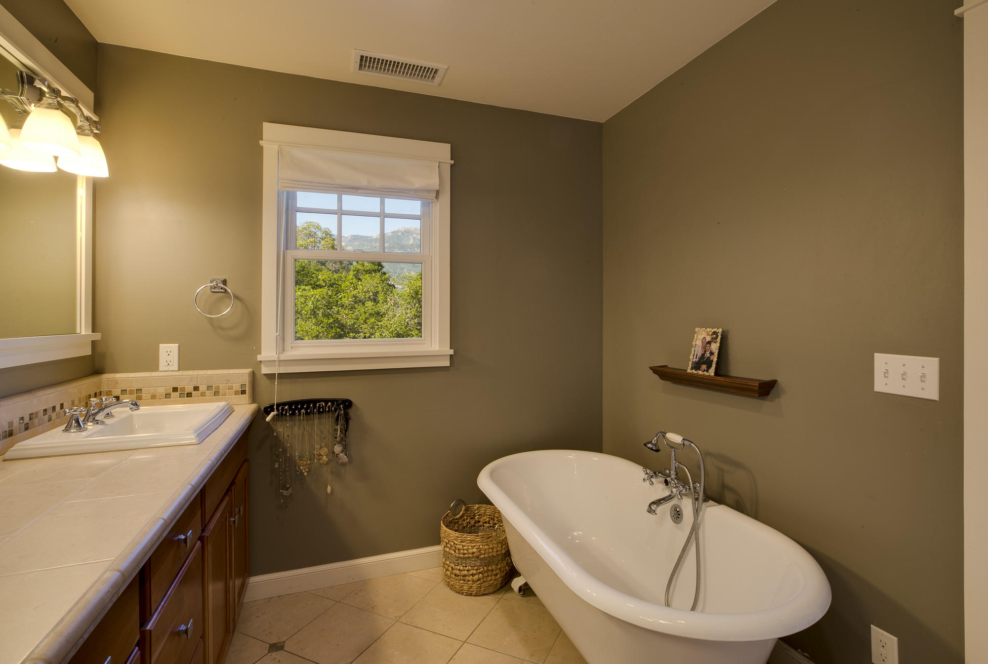 1006 Mission Ridge Road Santa Barbara, CA 93103 - Photo 7 of 21 a bathroom with a sink a window and a mirror