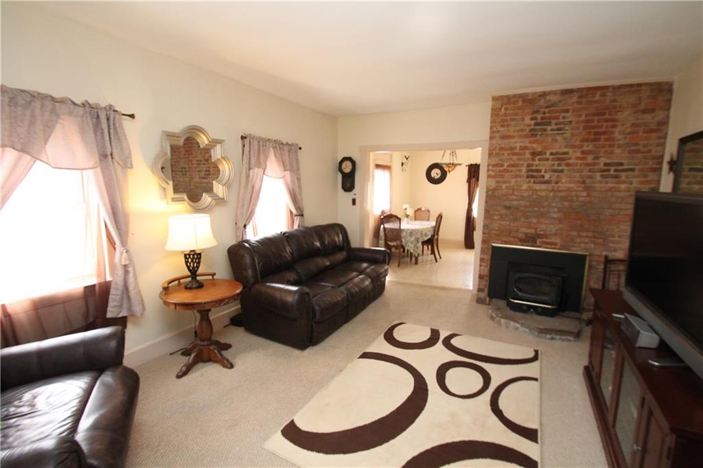 104 Sutherland Road Jeannette, PA 15644 - Photo 11 of 23 view from other side of the living room with woodburner.