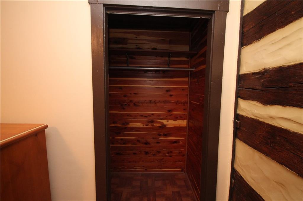 104 Sutherland Road Jeannette, PA 15644 - Photo 21 of 23 wood closet in bedroom with hard wood floors