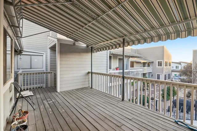a view of a brick house with many windows