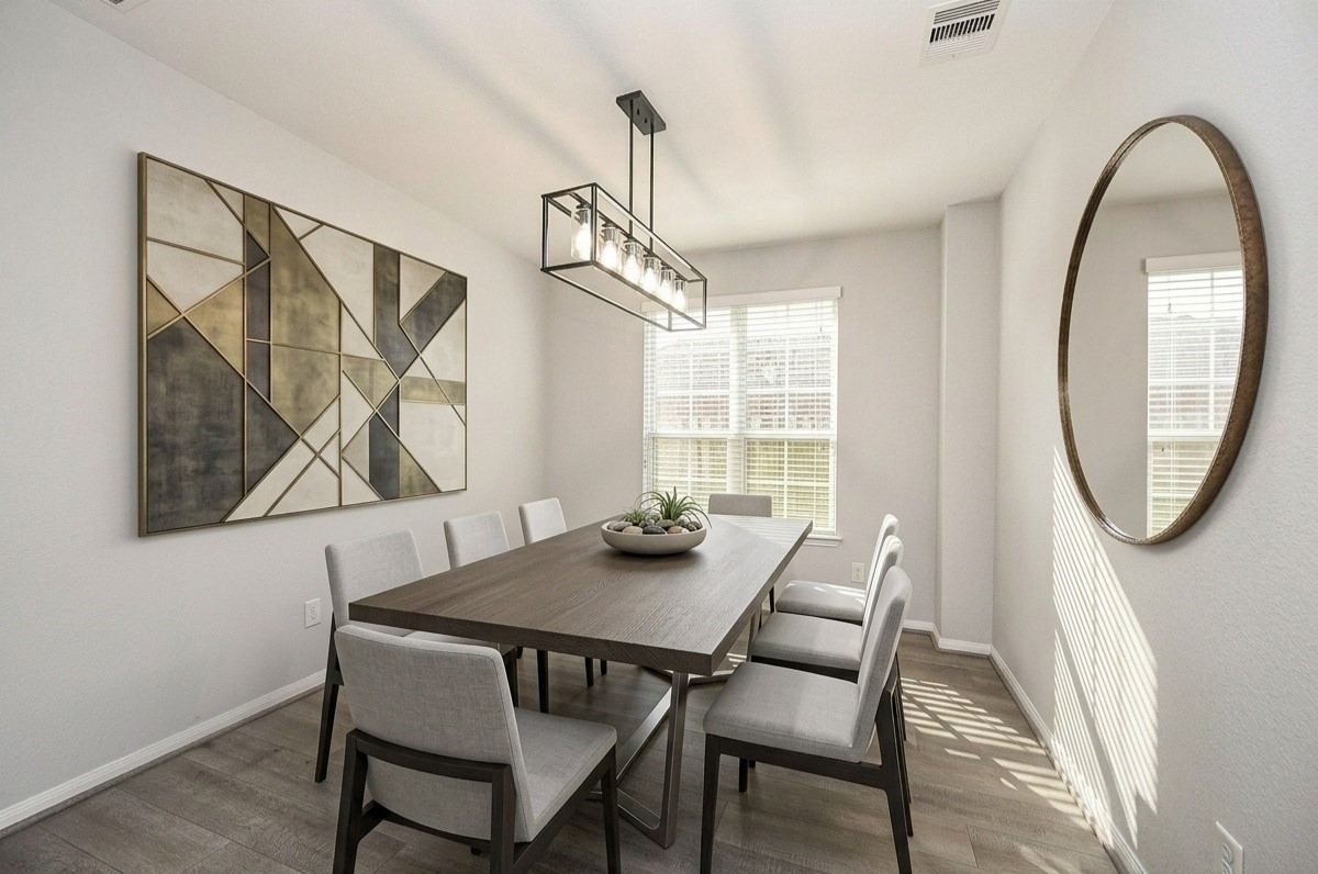 7042 Sliding Rock Circle Spring, TX 77379 - Photo 5 of 36 Elegant dining room with modern virtual staging, featuring stylish furniture and abundant natural light. Perfect for hosting and entertaining. Virtually Staged.