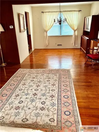 a view of a living room and kitchen