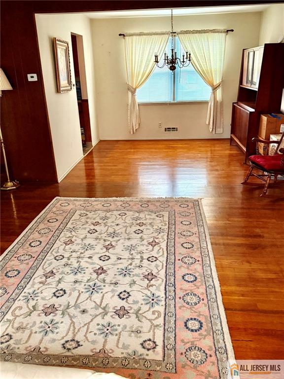 5 Meyer Road Edison, NJ 08817 - Photo 17 of 34 a view of a hallway to a livingroom with wooden floor