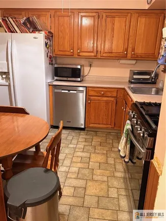 a kitchen with a stove and a table