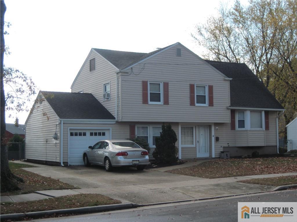 5 Meyer Road Edison, NJ 08817 - Photo 3 of 34 a front view of a house with a yard
