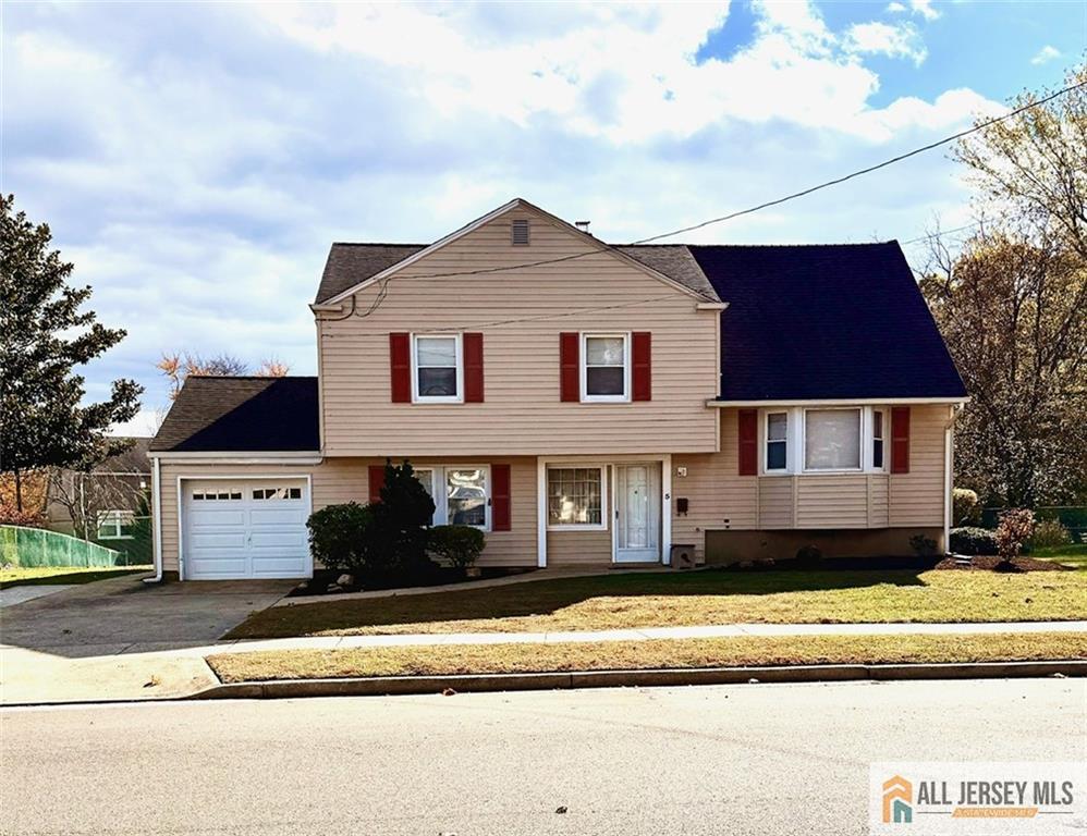 5 Meyer Road Edison, NJ 08817 - Photo 33 of 34 a front view of a house with a yard