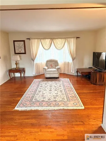 a view of a living room and kitchen
