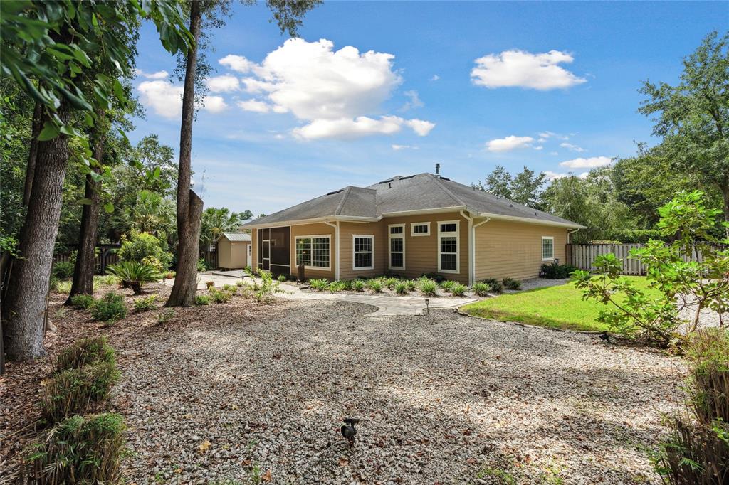 155 Southwest 118th Terrace Gainesville, FL 32607 - Photo 49 of 50 Room for a playset, shade-loving plants or dog house. Possibilities are endless!