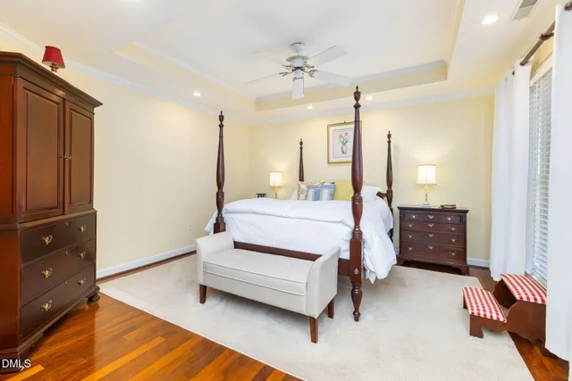 a bedroom with a bed and a lamp on table