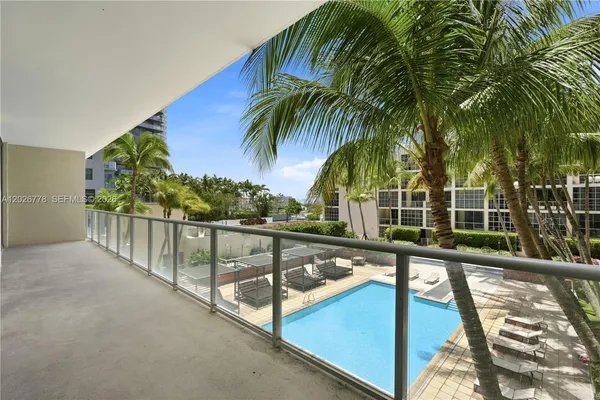 a view of a balcony with trees