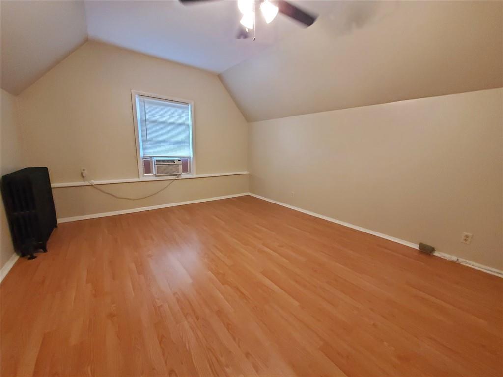 405 South Atlantic Avenue, Unit 3 Pittsburgh, PA 15224 - Photo 4 of 6 a view of an empty room with window and wooden floor