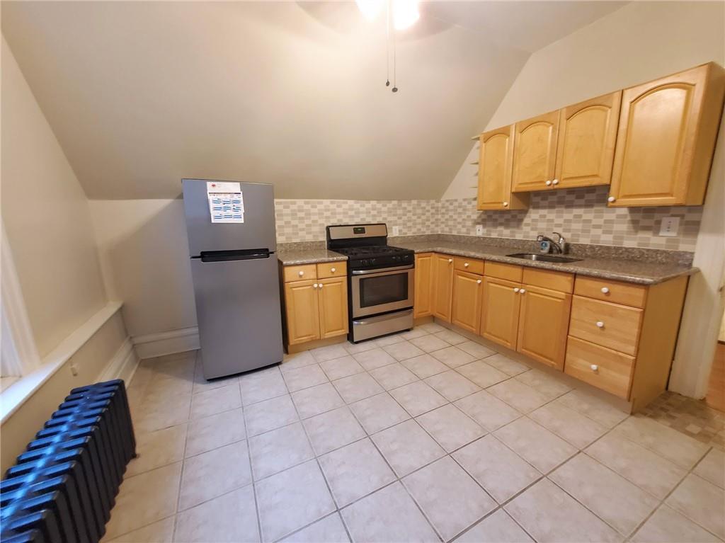 405 South Atlantic Avenue, Unit 3 Pittsburgh, PA 15224 - Photo 6 of 6 a kitchen with granite countertop a sink and cabinets