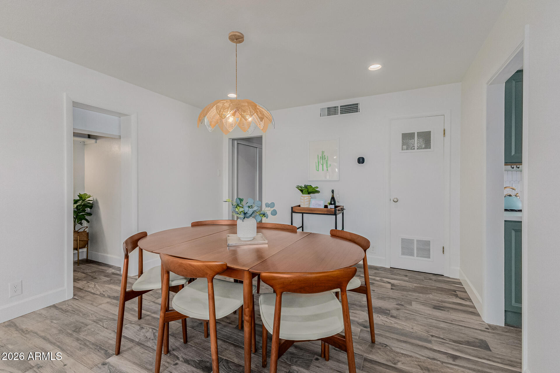 160 East Coronado Road, Unit 58 Phoenix, AZ 85004 - Photo 11 of 50 a view of a dining room with furniture and wooden floor