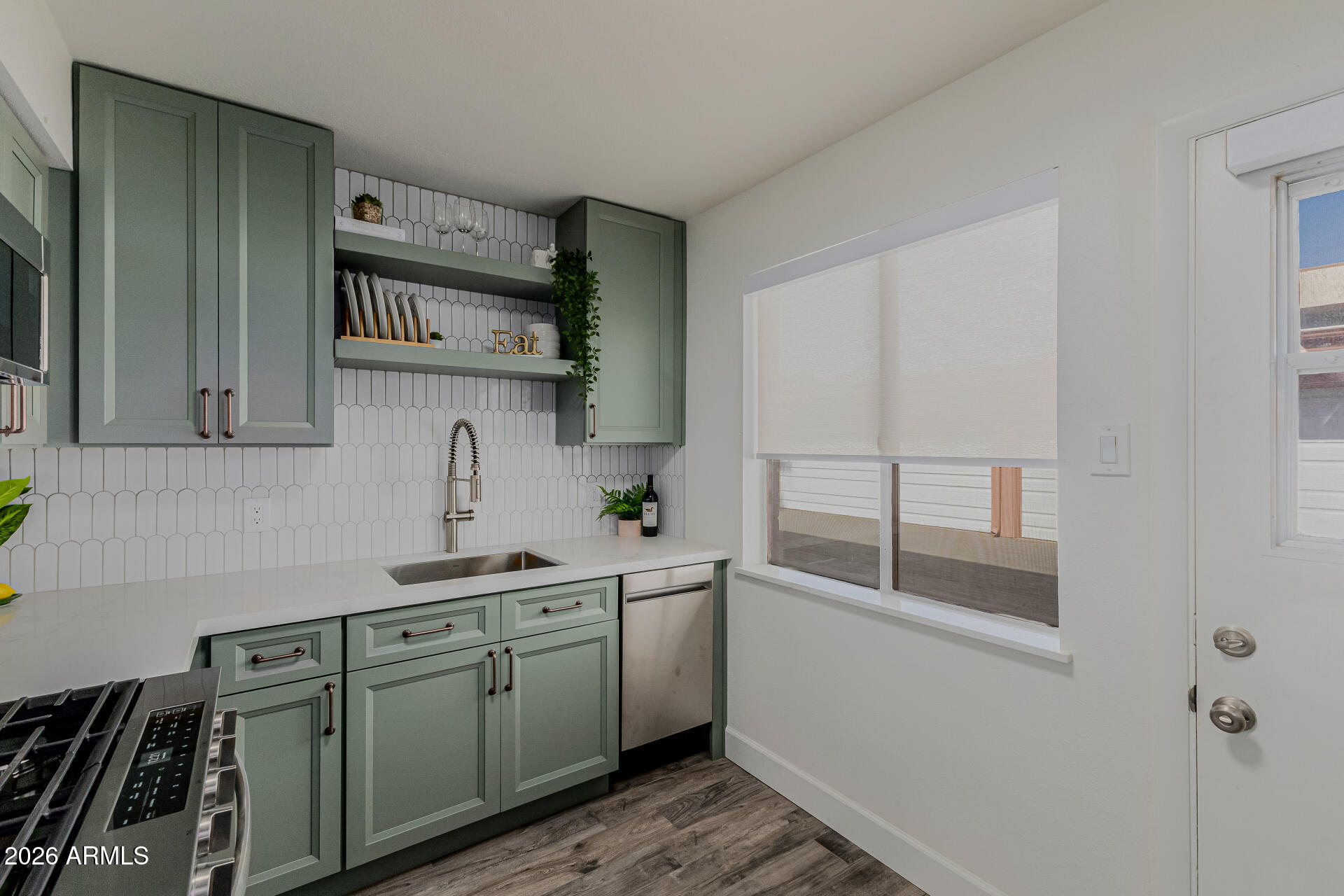160 East Coronado Road, Unit 58 Phoenix, AZ 85004 - Photo 14 of 50 a kitchen with a sink and cabinets
