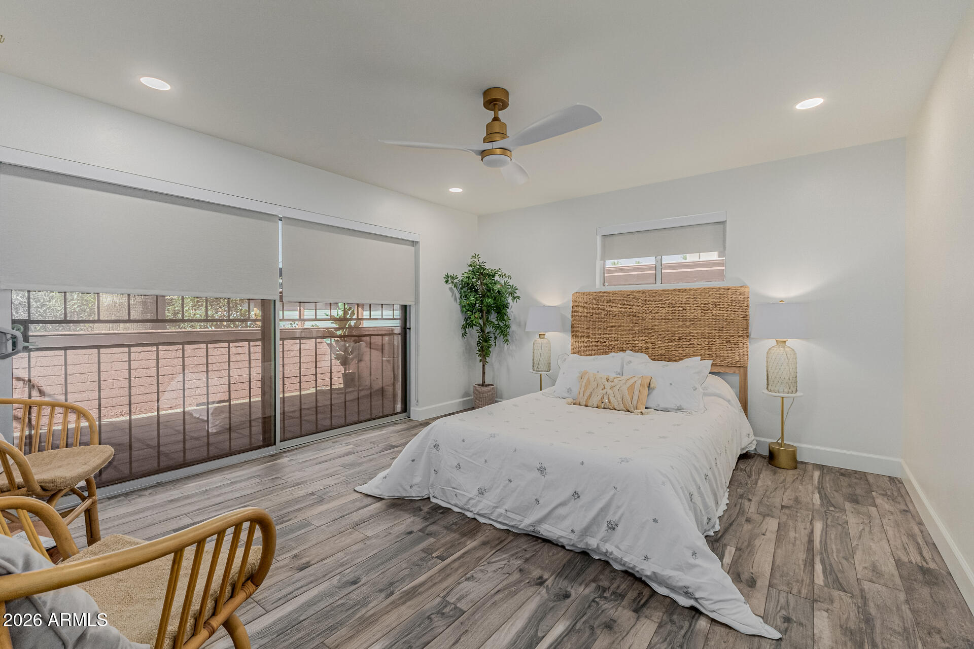 160 East Coronado Road, Unit 58 Phoenix, AZ 85004 - Photo 18 of 50 a bedroom with a bed and wooden floor