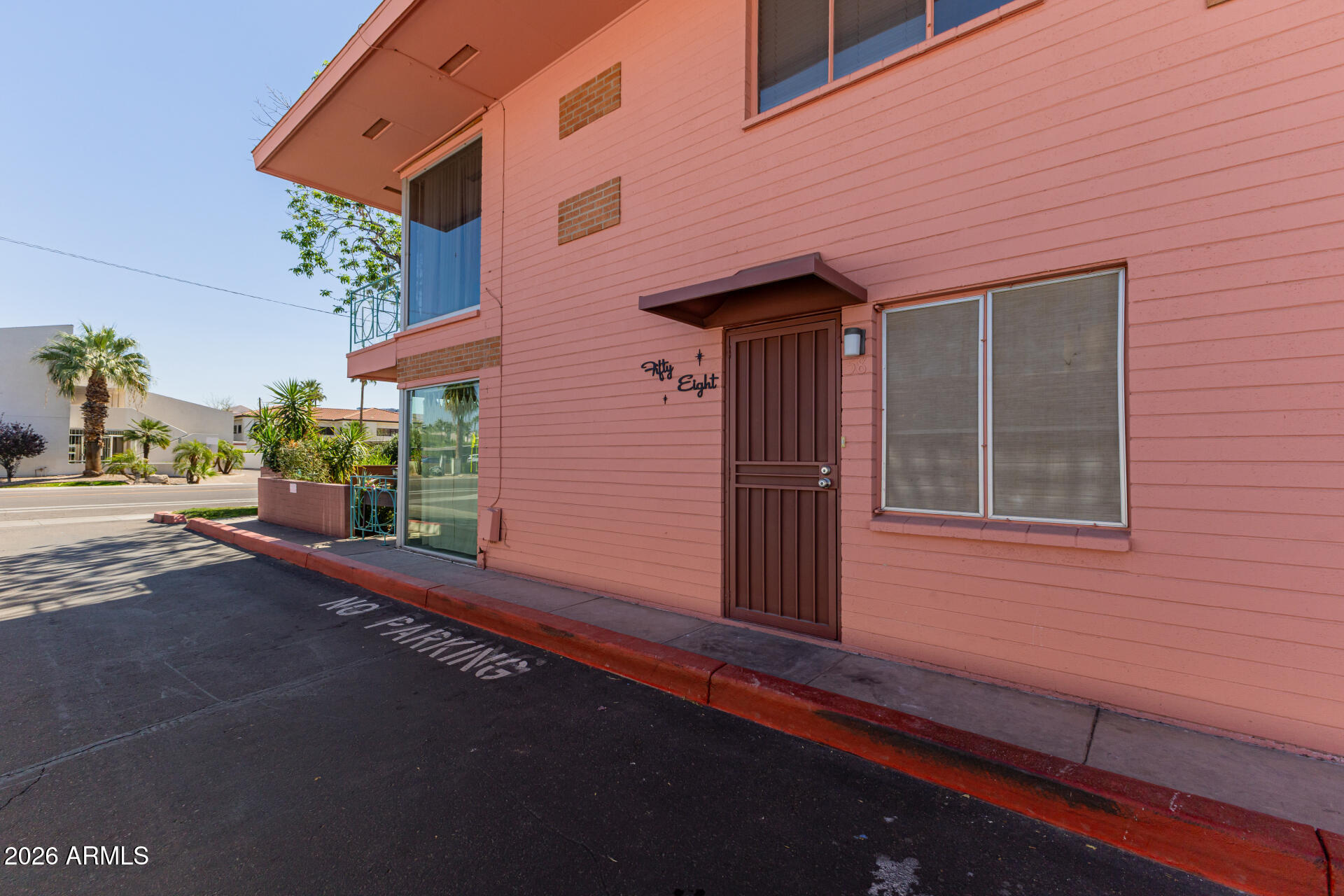 160 East Coronado Road, Unit 58 Phoenix, AZ 85004 - Photo 29 of 50 a front view of a house with a yard and garage