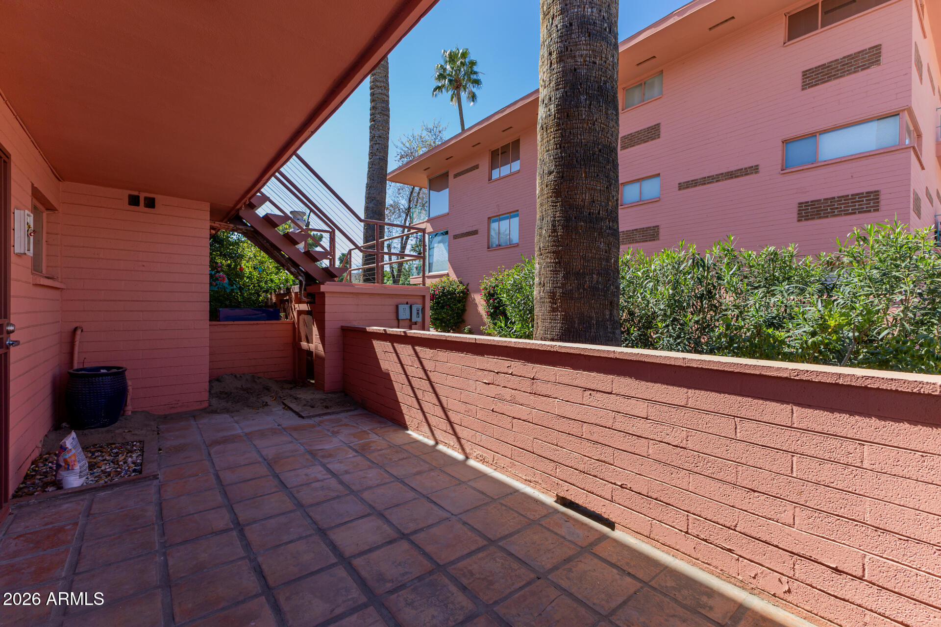 160 East Coronado Road, Unit 58 Phoenix, AZ 85004 - Photo 31 of 50 a view of balcony with wooden floor and potted plants