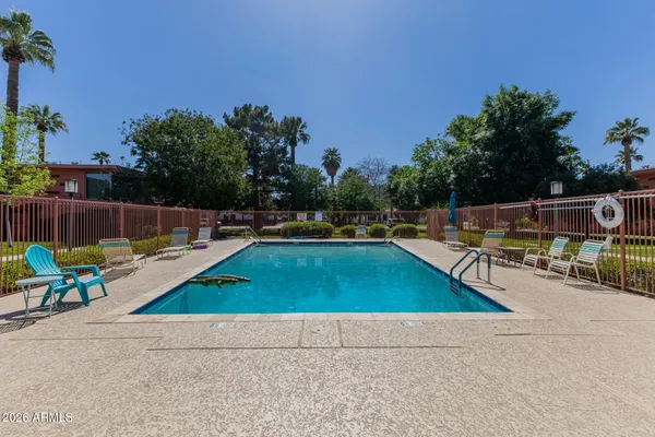 swimming pool with chairs