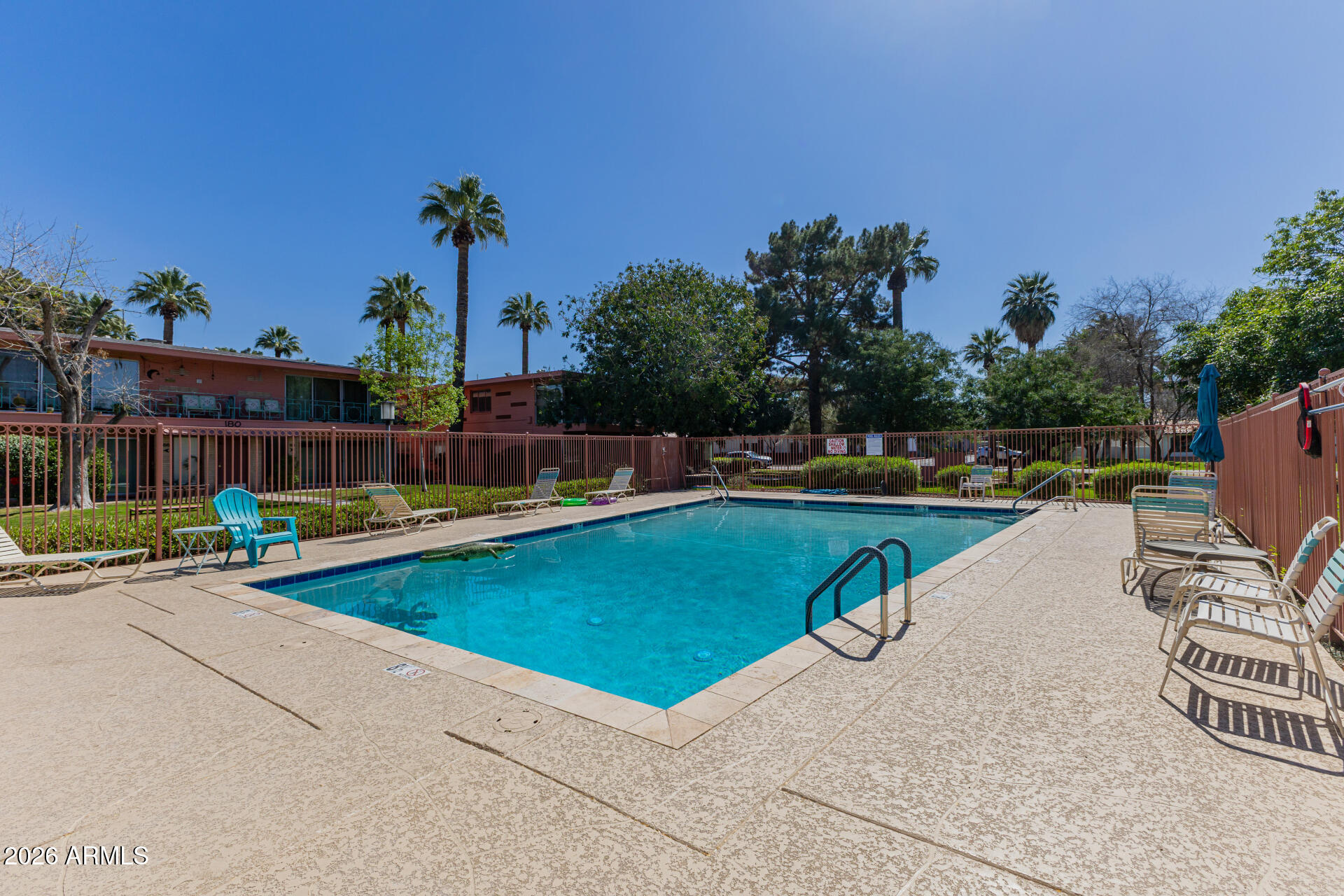 160 East Coronado Road, Unit 58 Phoenix, AZ 85004 - Photo 36 of 50 a view of a swimming pool with a lounge chairs