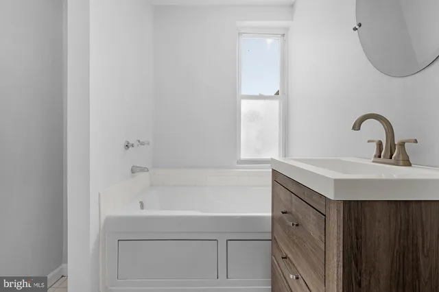 a bathroom with a sink and a bathtub