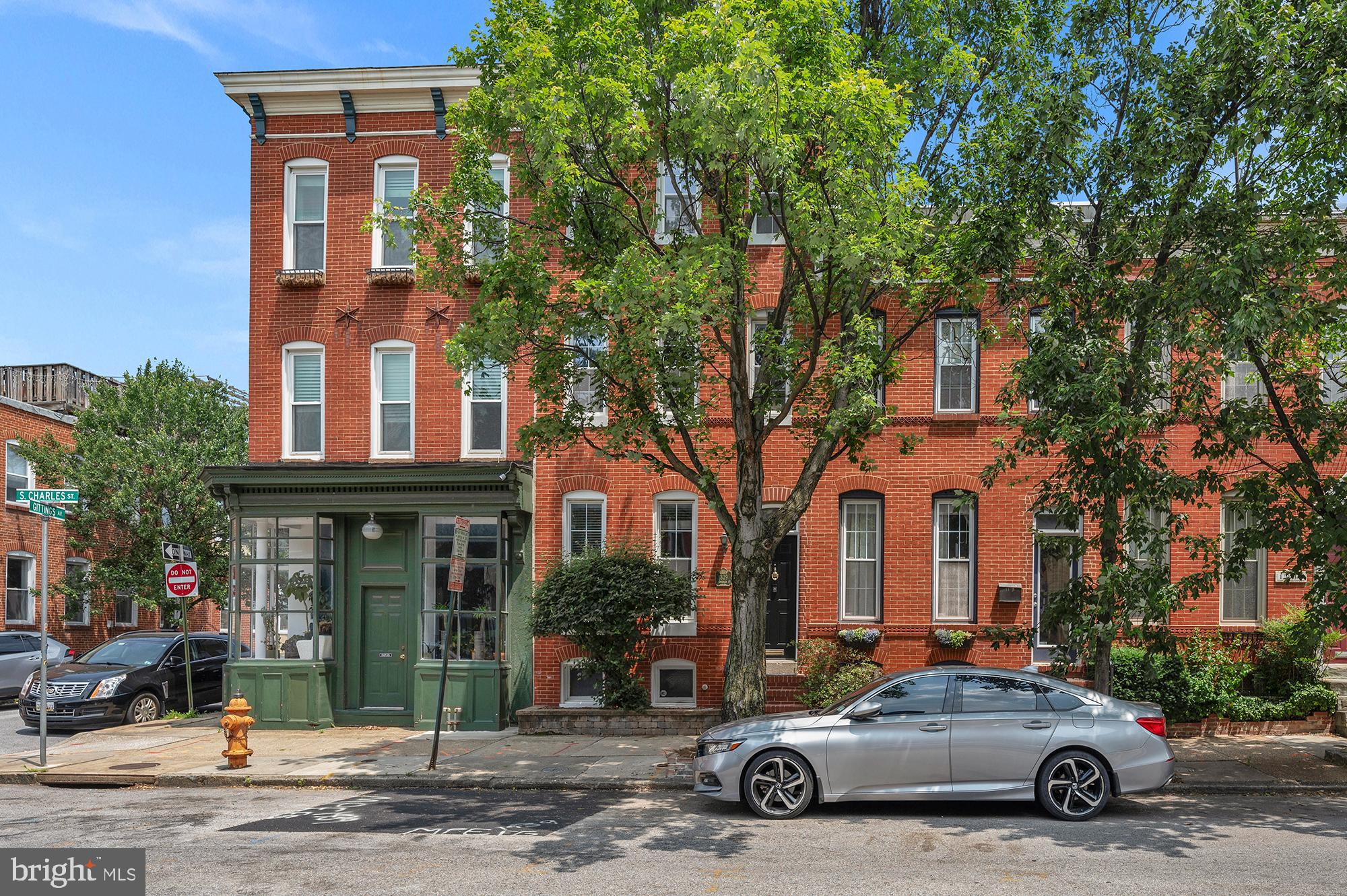 1329 South Charles Street Baltimore, MD 21230 - Photo 2 of 30 a car parked in front of a building