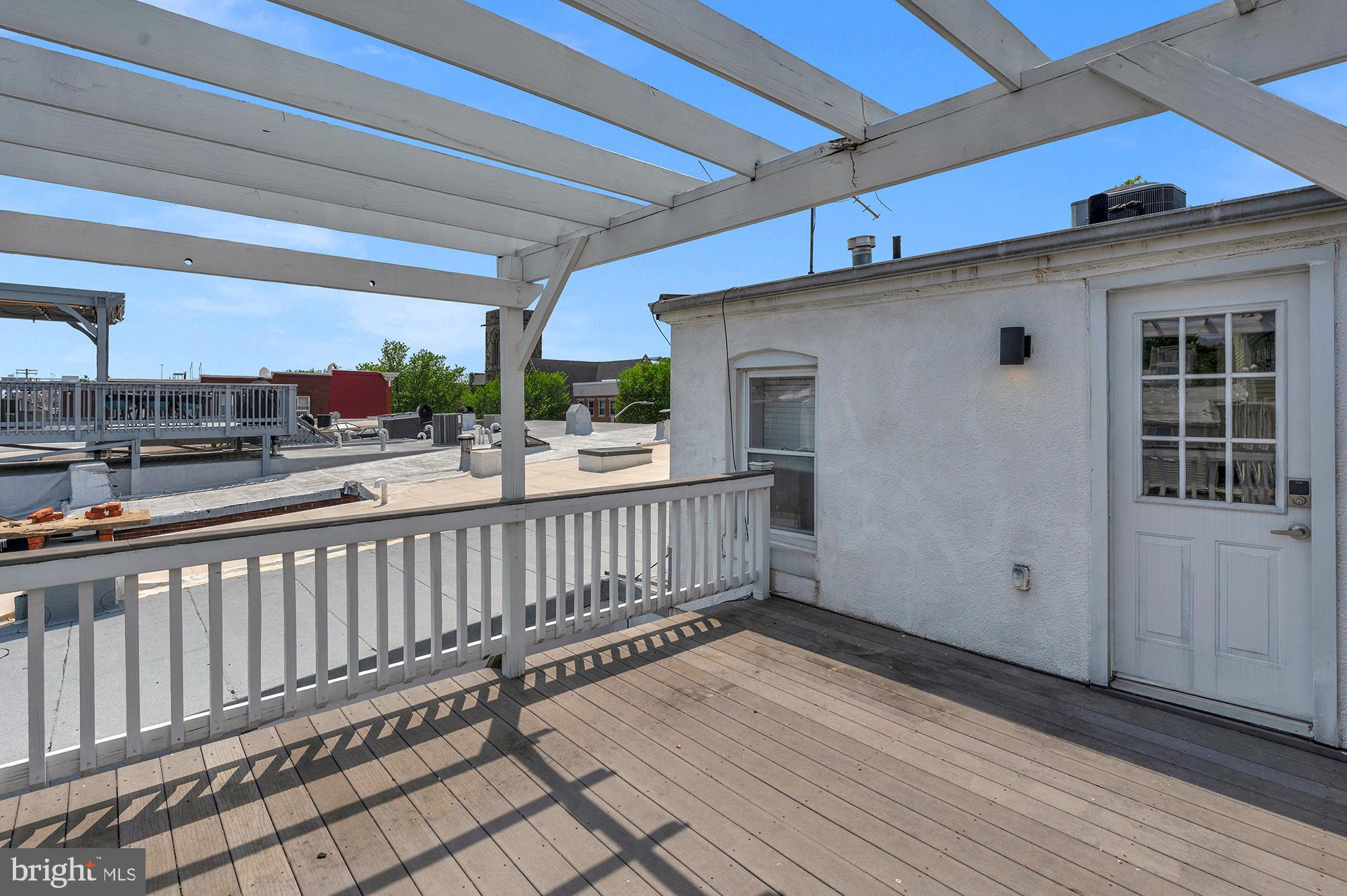 1329 South Charles Street Baltimore, MD 21230 - Photo 26 of 30 a view of a porch with wooden floor