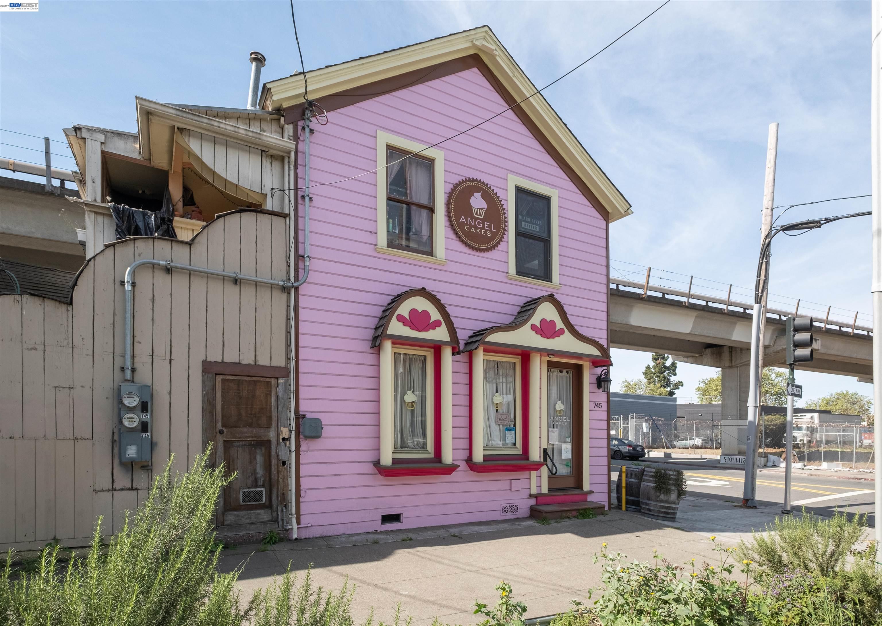 745 Fifth Street Oakland, CA 94607 - Photo 3 of 26 a view of a brick building with a bench in front of building