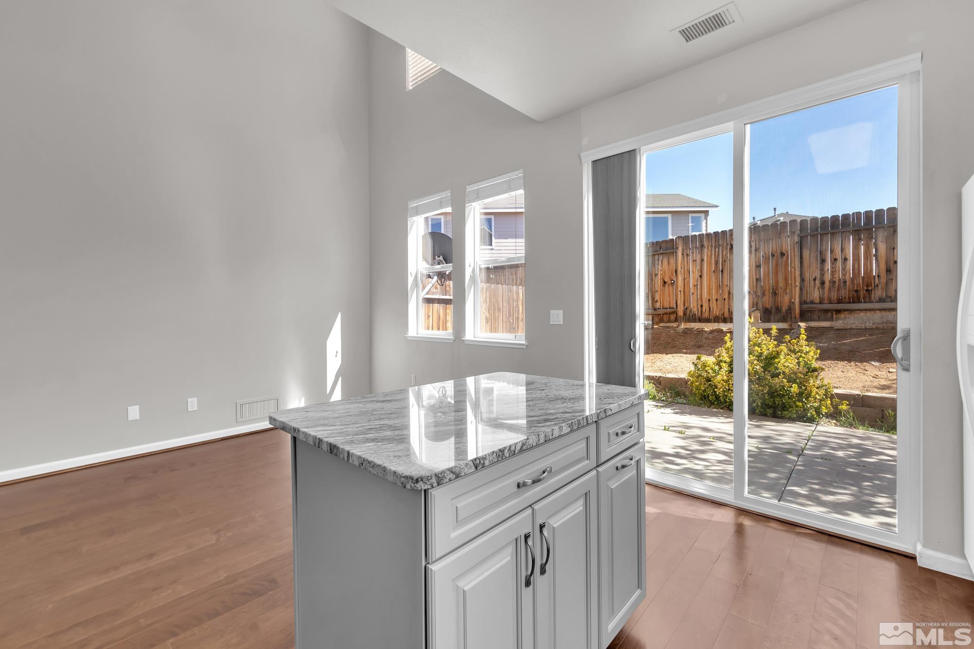 9266 Running Dog Circle Reno, NV 89506 - Photo 12 of 35 a bathroom with granite countertop a shower