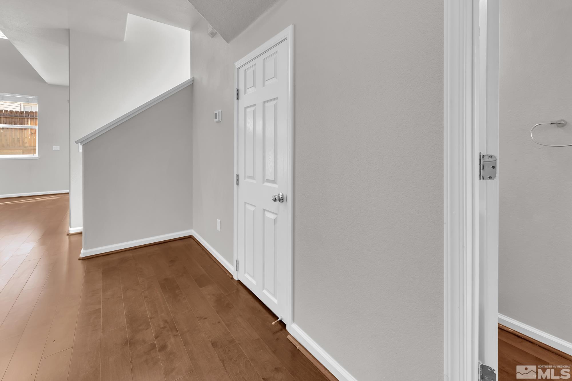 9266 Running Dog Circle Reno, NV 89506 - Photo 14 of 35 a view of a hallway with wooden floor